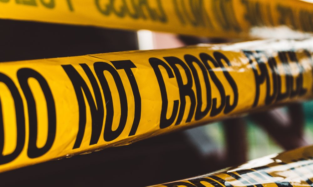 Photo of police tape. Photo courtesy of Davin Von Diemar on Unsplash.