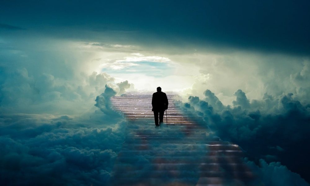 Photo of man walking up a set of stairs
