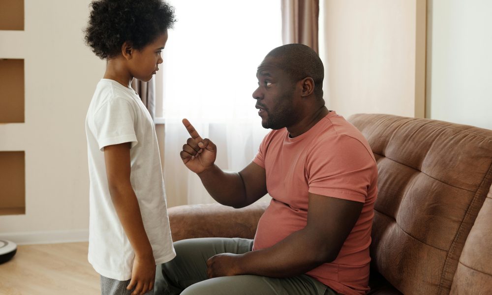 Father Talking to his Son. Photo courtesy of August de Richelieu on Pexels.