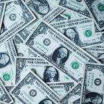 Picture of dollar bills courtesy of Alexander Grey on Unsplash.