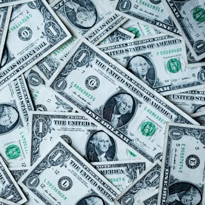 Picture of dollar bills courtesy of Alexander Grey on Unsplash.
