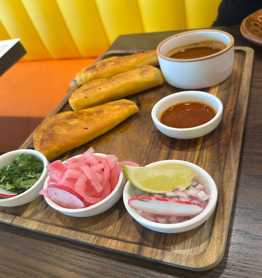 Image of birria tacos and toppings