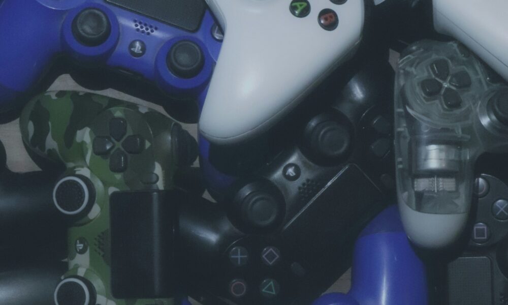 Photo of video game controllers. Photo courtesy of Pragii on Unsplash.