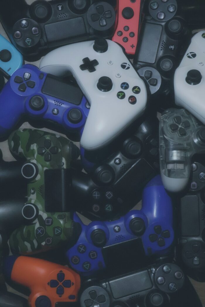 Photo of video game controllers. Photo courtesy of Pragii on Unsplash.
