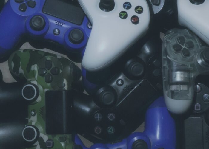 Photo of video game controllers. Photo courtesy of Pragii on Unsplash.