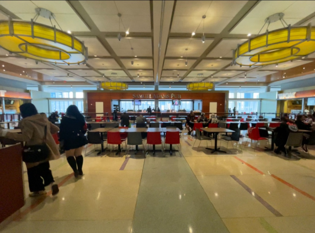 Photo of food court, showing seating areas and dining options.